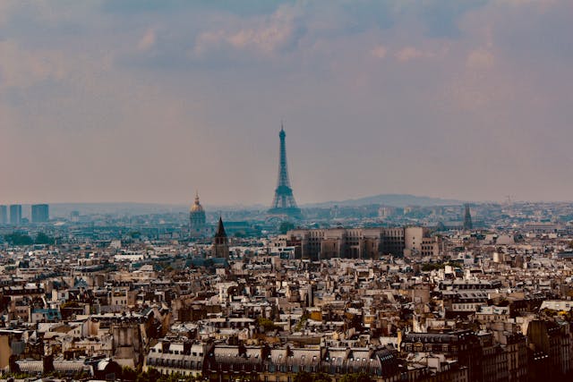 Explore Paris: Eiffel Tower, Louvre, and Seine cafes.