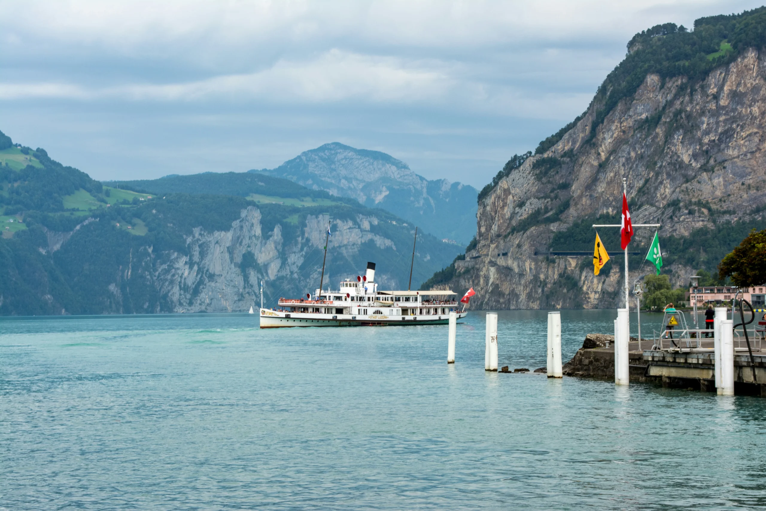 Relax on a paddle steamer against a backdrop of snow-capped peaks