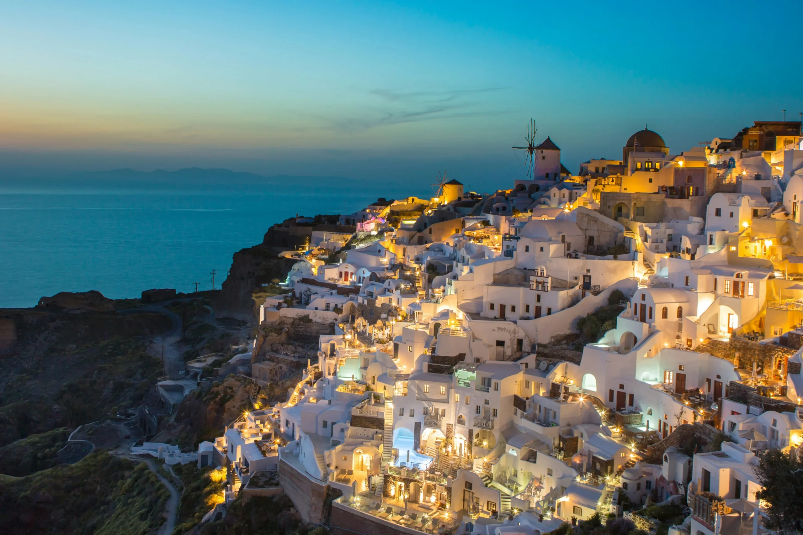 Oia sunsets, caldera‑view suites, vineyard tastings